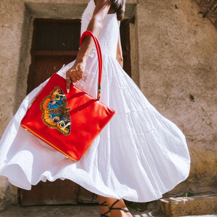 Borsa arancio con farfalla